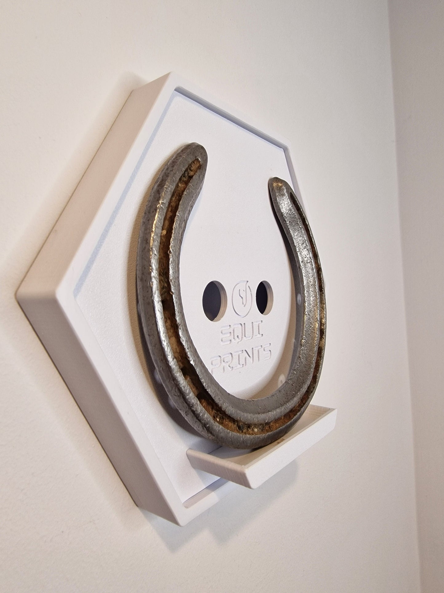 Wall-Mounted Horseshoe Display
